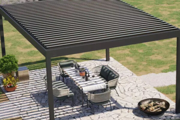 Motorized Louvered Pergola over a ptio with a chair stock image
