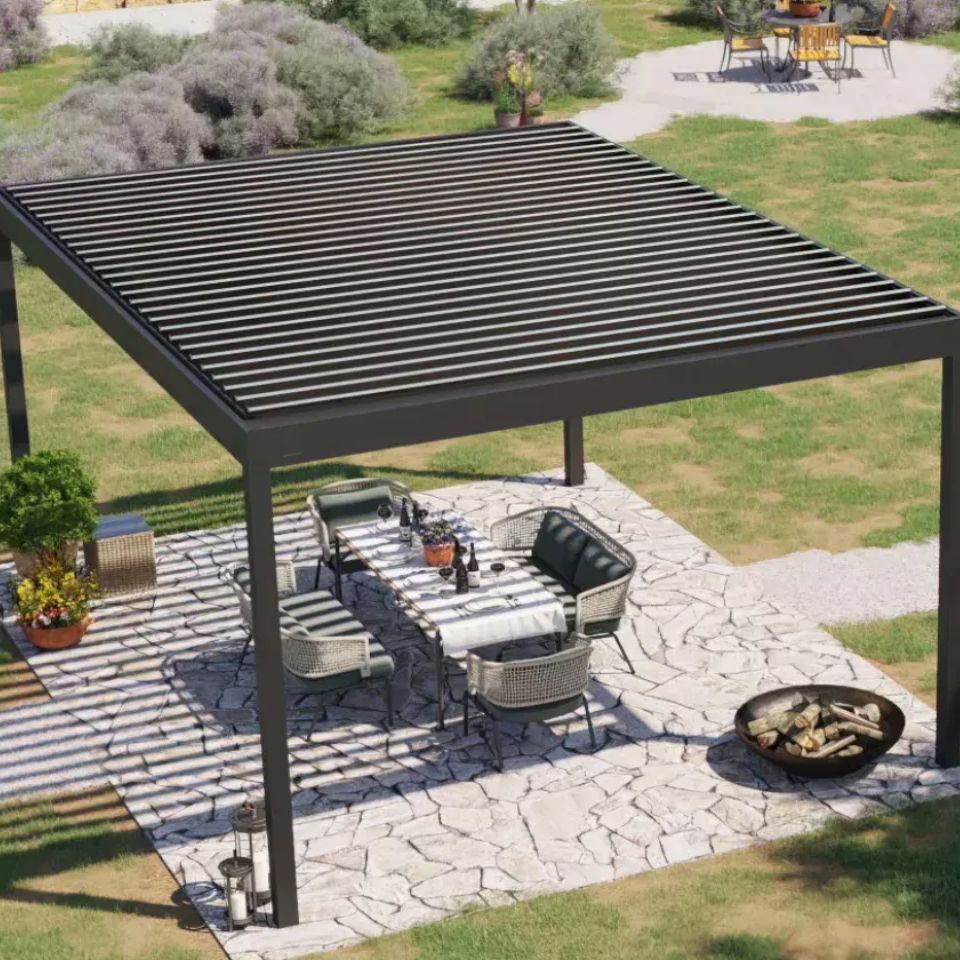 Motorized Louvered Pergola over a ptio with a chair stock image
