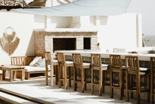 Outdoor bar with and a fireplace in the background